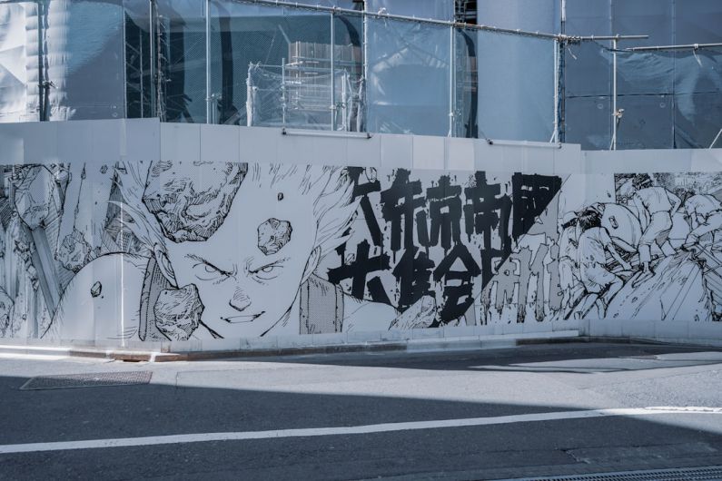 Manga - white and black graffiti on white wall