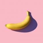 J-Pop - riped banana on pink surface