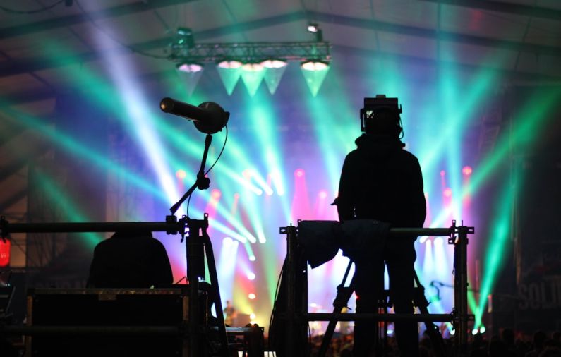 Visual Kei - silhouette of man standing on stage