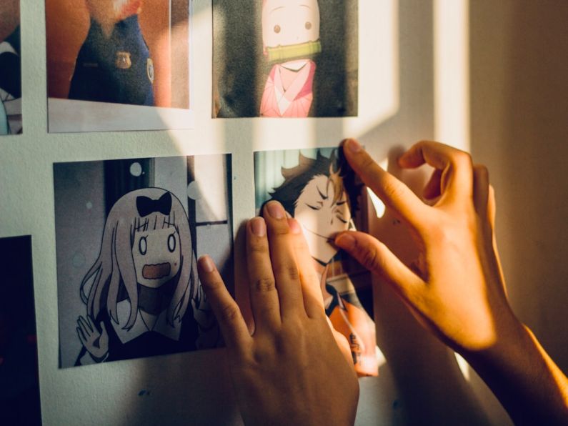 Anime - woman in black shirt taking selfie