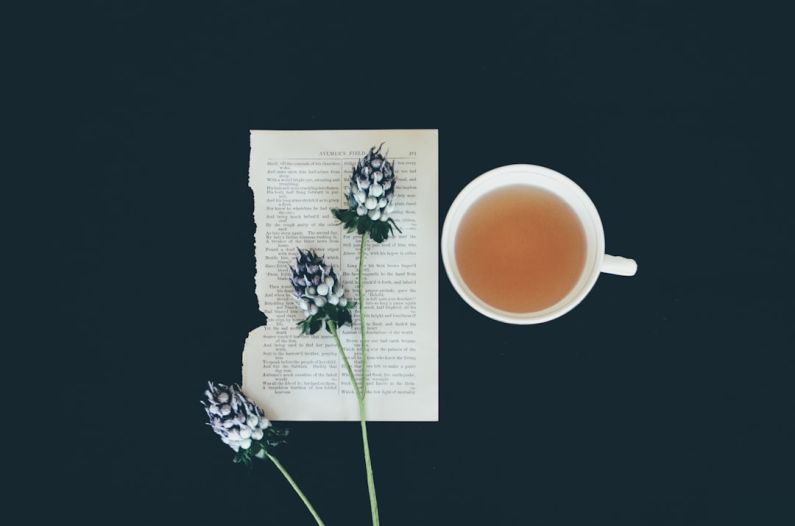 Tea Ceremonies - white ceramic tea cup beside white flowers