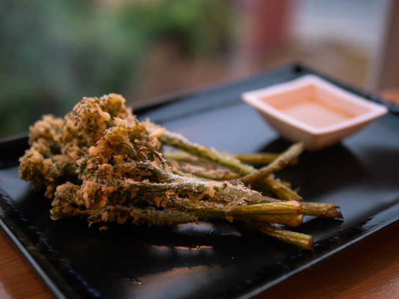 Tempura - brown dried leaves on brown wooden table