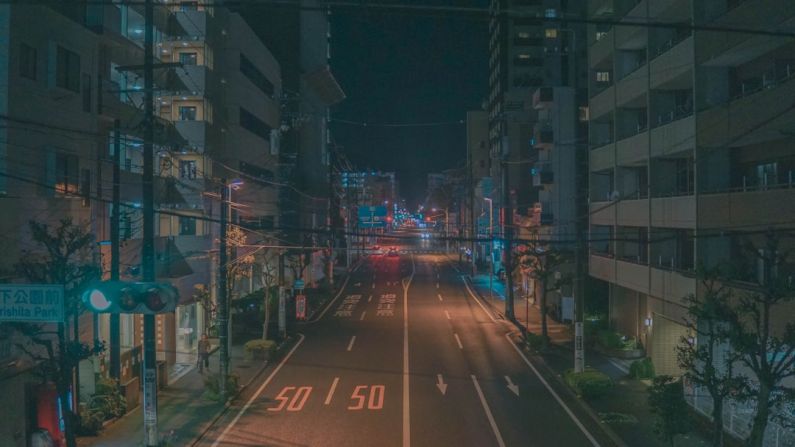 Anime - aerial view photography of road between highrise building